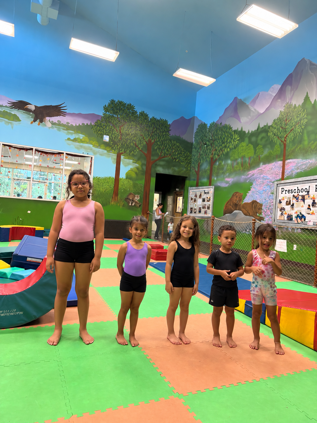 Tumbling students together in the gym